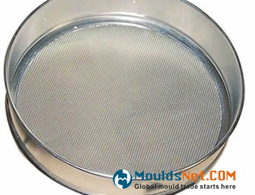 A stainless steel test sieve on the white background.