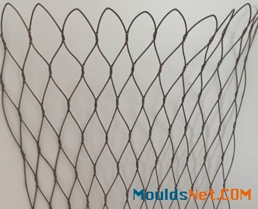 A piece of stainless steel knotted rope mesh hangs on the wall.