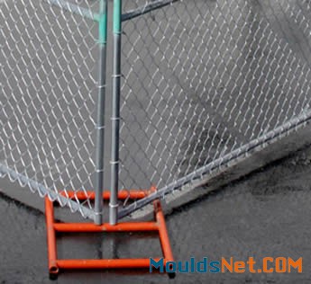 An orange powder coated me<em></em>tal fence feet are installed on the fence panels.