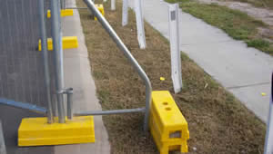 A portable fence bracing is installed on the fence panels.