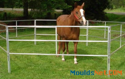 6 square pipe corral panels are co<em></em>nnected to enclose a horse on grassland