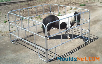 A square lightweight corral encloses a pony