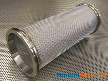 A stainless steel sintered cylindrical filter element on a perforated plate.